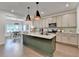 Stylish kitchen with a large island, granite countertops, stainless appliances, and pendant lighting at 5650 Bergeson Ways, Cumming, GA 30028
