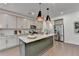 Spacious kitchen with granite countertops, stainless appliances, and a large center island for food preparation at 5650 Bergeson Ways, Cumming, GA 30028