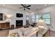 Bright and open living room featuring a fireplace and seamless access to other living spaces at 5650 Bergeson Ways, Cumming, GA 30028
