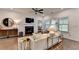 Open-concept living room with modern decor, fireplace, and plenty of natural light at 5650 Bergeson Ways, Cumming, GA 30028