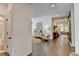Open-concept living space with hardwood floors and modern furnishings at 5650 Bergeson Ways, Cumming, GA 30028