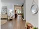 Inviting living space featuring hardwood floors, neutral decor, and ample natural light at 5650 Bergeson Ways, Cumming, GA 30028