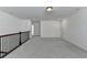 Neutral loft area with gray carpet and a staircase railing at 5650 Bergeson Ways, Cumming, GA 30028