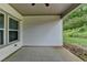 Covered patio with vinyl siding and concrete slab at 5650 Bergeson Ways, Cumming, GA 30028