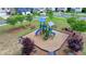 Brightly colored playground with slides and climbing features, set in a landscaped community space at 5650 Bergeson Ways, Cumming, GA 30028