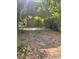 Driveway leading to a covered parking area and the home at 61 Kathy Ln, Temple, GA 30179