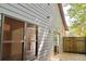 Back exterior view of home with wood deck and sliding glass doors at 70 Gardenia Nw Dr, Atlanta, GA 30314