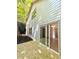 Features a new wooden deck, perfect for outdoor gatherings and relaxation, with a view through sliding glass doors at 70 Gardenia Nw Dr, Atlanta, GA 30314