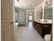 Modern bathroom featuring dual vanity, tile flooring, and a walk-in shower at 70 Gardenia Nw Dr, Atlanta, GA 30314