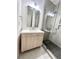 Modern bathroom featuring a vanity with drawers and a glass-enclosed shower at 70 Gardenia Nw Dr, Atlanta, GA 30314