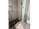 Bathroom showing the black tiled shower floor and a clear glass door at 70 Gardenia Nw Dr, Atlanta, GA 30314