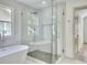Elegant bathroom with a frameless glass shower and soaking tub at 70 Gardenia Nw Dr, Atlanta, GA 30314
