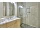 Modern bathroom featuring a vanity with drawers and a glass-enclosed shower at 70 Gardenia Nw Dr, Atlanta, GA 30314