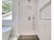 Modern bathroom featuring a glass shower with black tile floor and soaking tub at 70 Gardenia Nw Dr, Atlanta, GA 30314