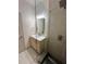 Bathroom with wood cabinet and a clear glass shower with black tiled floor at 70 Gardenia Nw Dr, Atlanta, GA 30314