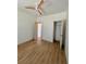 An empty bedroom with wood floors and light walls and a closet in the corner at 70 Gardenia Nw Dr, Atlanta, GA 30314
