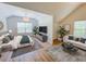 Comfortable bedroom with a bed, sofa, rugs and stylish decor in a modern setting at 70 Gardenia Nw Dr, Atlanta, GA 30314