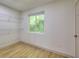 Cozy closet with wire shelving and a bright window overlooking a lush landscape at 70 Gardenia Nw Dr, Atlanta, GA 30314