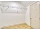 Walk-in closet with white shelving and a door, perfect for organization and storage at 70 Gardenia Nw Dr, Atlanta, GA 30314