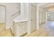 Welcoming entryway with bright white walls and a built-in storage unit with drawers at 70 Gardenia Nw Dr, Atlanta, GA 30314