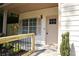 Close up of the front entrance, showing well manicured landscaping, detailed trim and new railing at 70 Gardenia Nw Dr, Atlanta, GA 30314