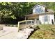 Inviting two-story home featuring a freshly landscaped front yard and newly installed railings at 70 Gardenia Nw Dr, Atlanta, GA 30314