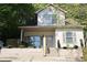 Charming two-story home features a well-maintained yard and inviting front porch at 70 Gardenia Nw Dr, Atlanta, GA 30314