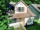 A charming two-story home boasts manicured landscaping and inviting front entrance at 70 Gardenia Nw Dr, Atlanta, GA 30314