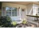 Up close front porch featuring well manicured landscaping and detailed trim at 70 Gardenia Nw Dr, Atlanta, GA 30314