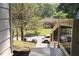 View of the front yard and street, showcasing landscaped lawn and a view of a car parked on the street at 70 Gardenia Nw Dr, Atlanta, GA 30314
