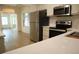Modern kitchen with stainless steel appliances opens to the living area at 70 Gardenia Nw Dr, Atlanta, GA 30314