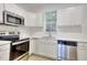 Bright, modern kitchen featuring stainless steel appliances and updated finishes at 70 Gardenia Nw Dr, Atlanta, GA 30314