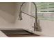 Close up image of kitchen sink, faucet and quartz countertops at 70 Gardenia Nw Dr, Atlanta, GA 30314