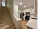 Bright kitchen featuring stainless steel appliances, white cabinetry, and sleek countertops at 70 Gardenia Nw Dr, Atlanta, GA 30314