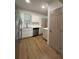 Bright kitchen features stainless appliances, white cabinets and quartz countertops at 70 Gardenia Nw Dr, Atlanta, GA 30314