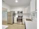 View of updated kitchen with stainless steel appliances and quartz countertops at 70 Gardenia Nw Dr, Atlanta, GA 30314