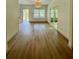 Bright open-concept living area with sliding patio doors, hardwood flooring and a light neutral paint at 70 Gardenia Nw Dr, Atlanta, GA 30314