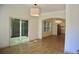 Open living room features sliding glass doors to a backyard patio and new hardwood floors at 70 Gardenia Nw Dr, Atlanta, GA 30314