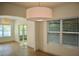 Bright open-concept living area with sliding patio doors, hardwood flooring and a light neutral paint at 70 Gardenia Nw Dr, Atlanta, GA 30314