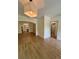 Open living and dining space featuring hardwood floors, modern lighting, and neutral wall paint at 70 Gardenia Nw Dr, Atlanta, GA 30314