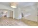 Open-concept living area with an archway to the kitchen and a view of a bathroom at 70 Gardenia Nw Dr, Atlanta, GA 30314