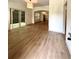 Open living room features sliding glass doors to a backyard patio and new hardwood floors at 70 Gardenia Nw Dr, Atlanta, GA 30314