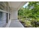 Inviting porch with black aluminum railing and lush green views at 70 Gardenia Nw Dr, Atlanta, GA 30314