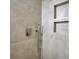 Modern shower featuring a handheld shower head and built-in shelves at 70 Gardenia Nw Dr, Atlanta, GA 30314