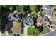 An aerial view of homes with mature landscaping and manicured lawns in this beautiful neighborhood at 5420 Avonshire Ln, Cumming, GA 30040