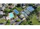 Aerial view of the neighborhood amenities including a pool, tennis courts, parking, and lush landscaping at 5420 Avonshire Ln, Cumming, GA 30040