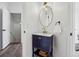 Stylish powder room with vanity, updated fixtures, and a decorative mirror at 5420 Avonshire Ln, Cumming, GA 30040