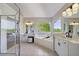 Spacious primary bathroom featuring a shower, double vanity, and soaking tub at 5420 Avonshire Ln, Cumming, GA 30040
