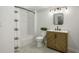 Well-lit bathroom with stylish vanity, modern fixtures, and hexagon tile floors at 5420 Avonshire Ln, Cumming, GA 30040