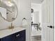 Beautiful powder room with updated fixtures and features a doorway to an office at 5420 Avonshire Ln, Cumming, GA 30040